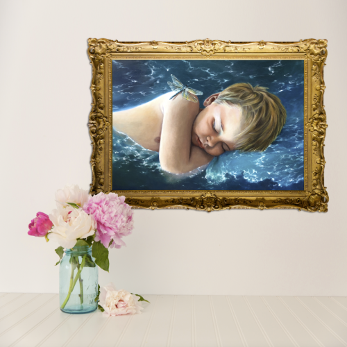 A surrealist gold-framed painting on a wall depicts a sleeping child with a butterfly on his head, floating on water. Below, on a white surface sits The Cut vase with pink and white pe.