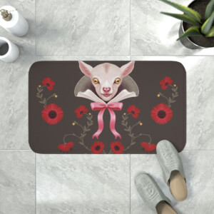 A whimsical doormat design featuring a surreal illustration of a pale pink sphynx cat with oversized ears, centered between red flowers and a pink bow, on a gray background with shoes nearby.