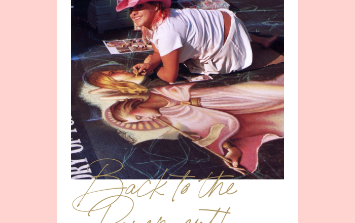 A woman in a pink cap draws a chalk mural of a girl on pavement. a polaroid-style image with the text "back to the pavement" at the bottom.